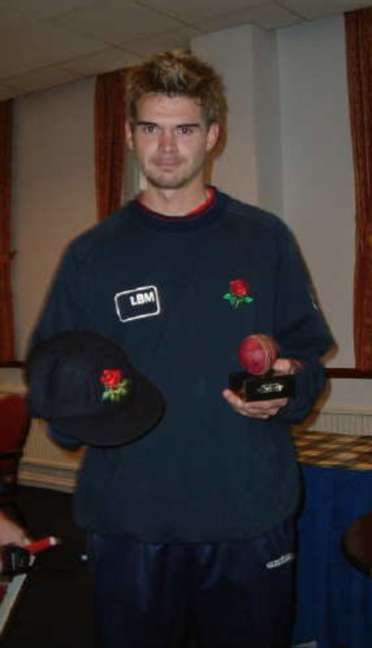 Jimmy Anderson celebrates his England call up by receiving his County Cap and the ball in which he took his hat-trick against Essex.