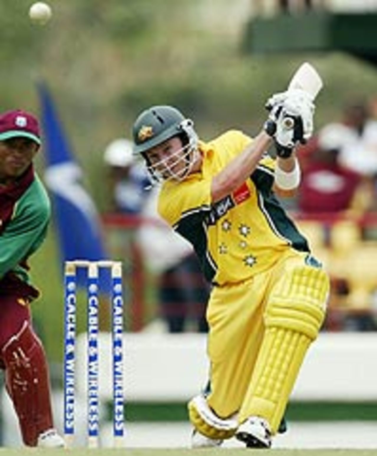 Australia's Michael Clarke lofts for four against West Indies in St Lucia (May 21, 2003)