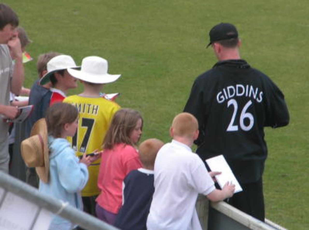 Ed Giddins oblidges the young autograph hunters