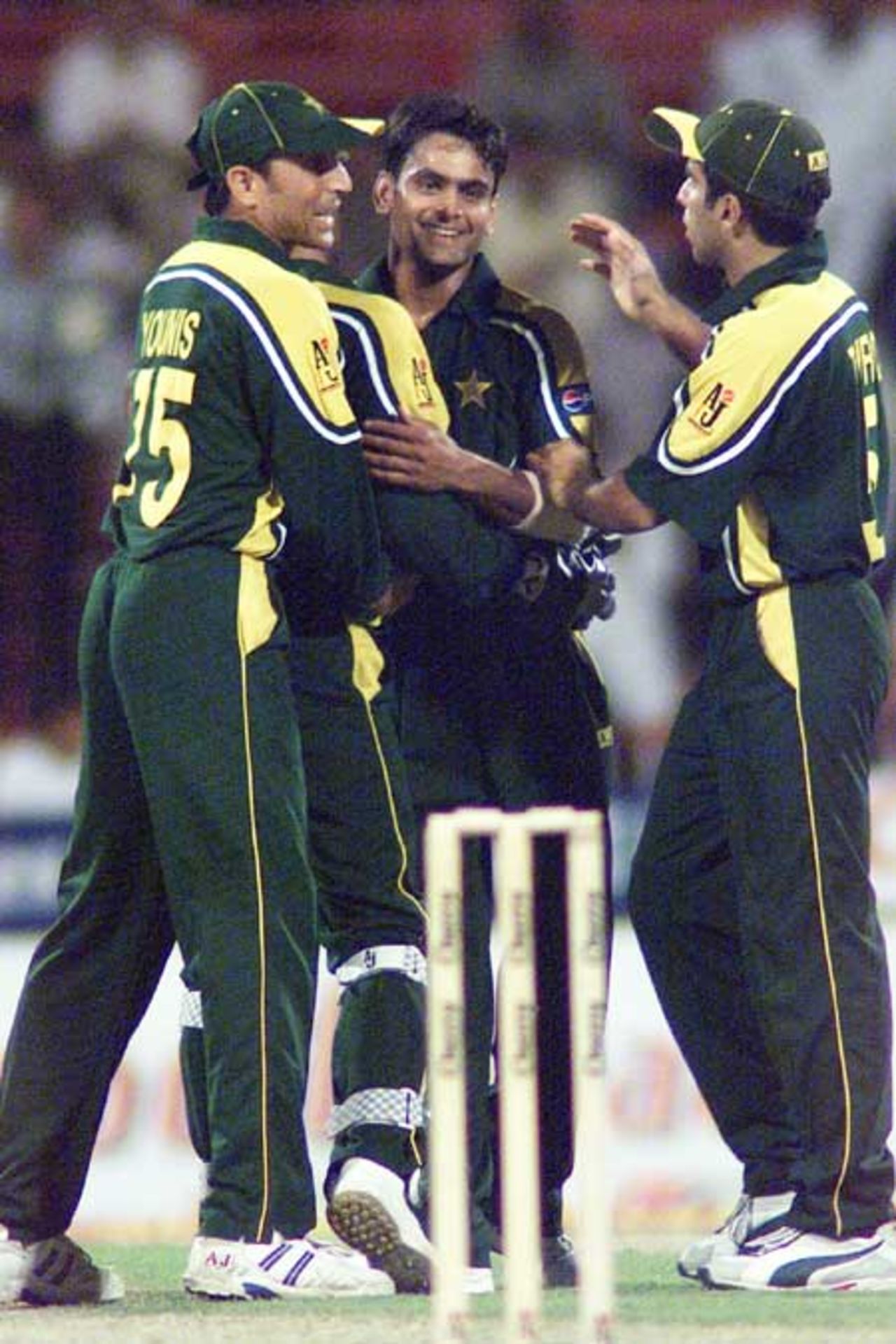 Mohammad Hafeez congratulated by Younis Khan and Taufeeq Umar after taking a wicket, 1st Match: Pakistan v Zimbabwe, Cherry Blossom Sharjah Cup, 3 April 2003