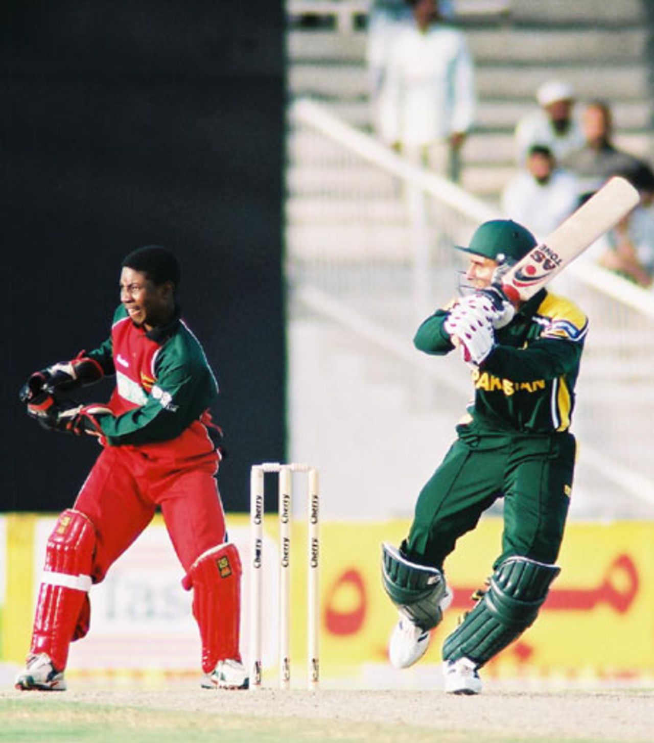 Abdul Razzaq smacks the ball through point, 1st Match: Pakistan v Zimbabwe, Cherry Blossom Sharjah Cup, 3 April 2003
