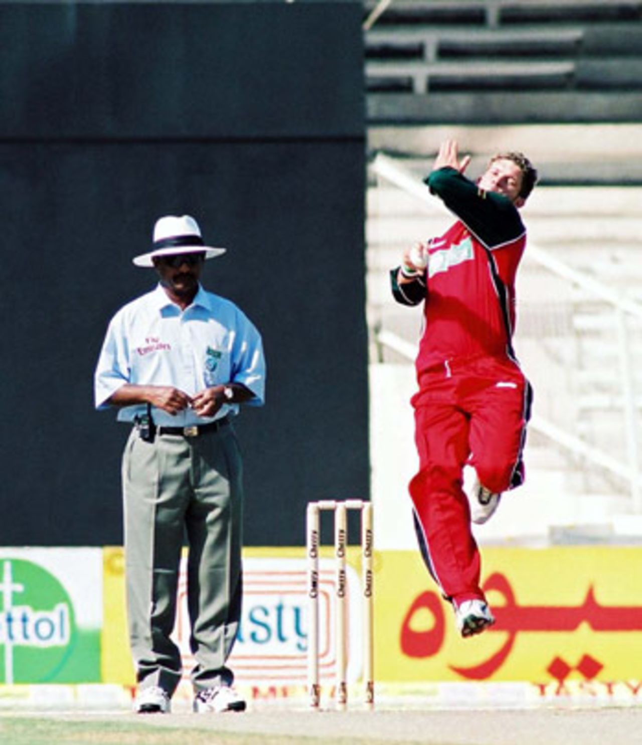Andy Blignaut in his follow through, 1st Match: Pakistan v Zimbabwe, Cherry Blossom Sharjah Cup, 3 April 2003