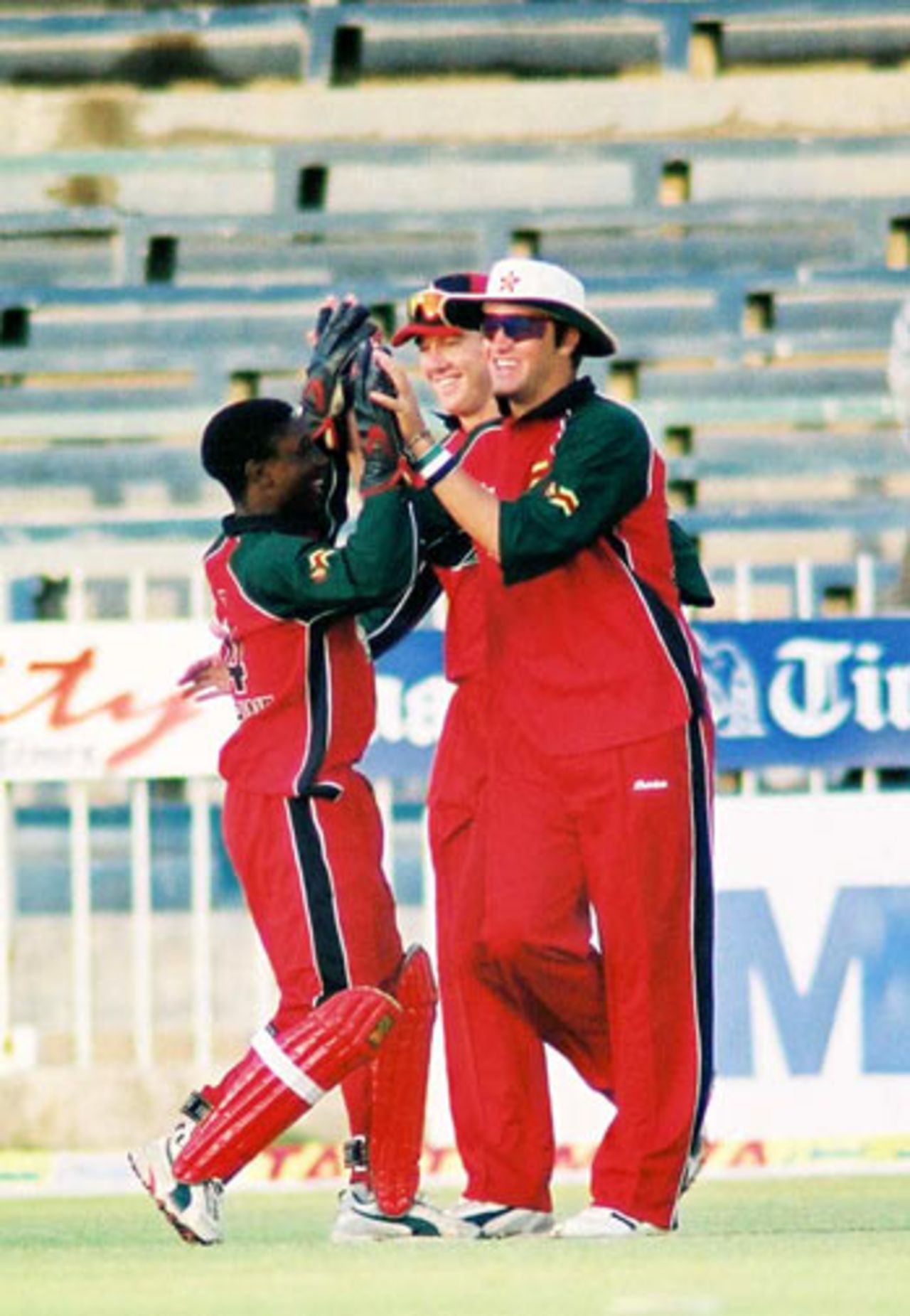 Sean Ervin and Tatenda Taibu celebrating a dismissal, 1st Match: Pakistan v Zimbabwe, Cherry Blossom Sharjah Cup, 3 April 2003