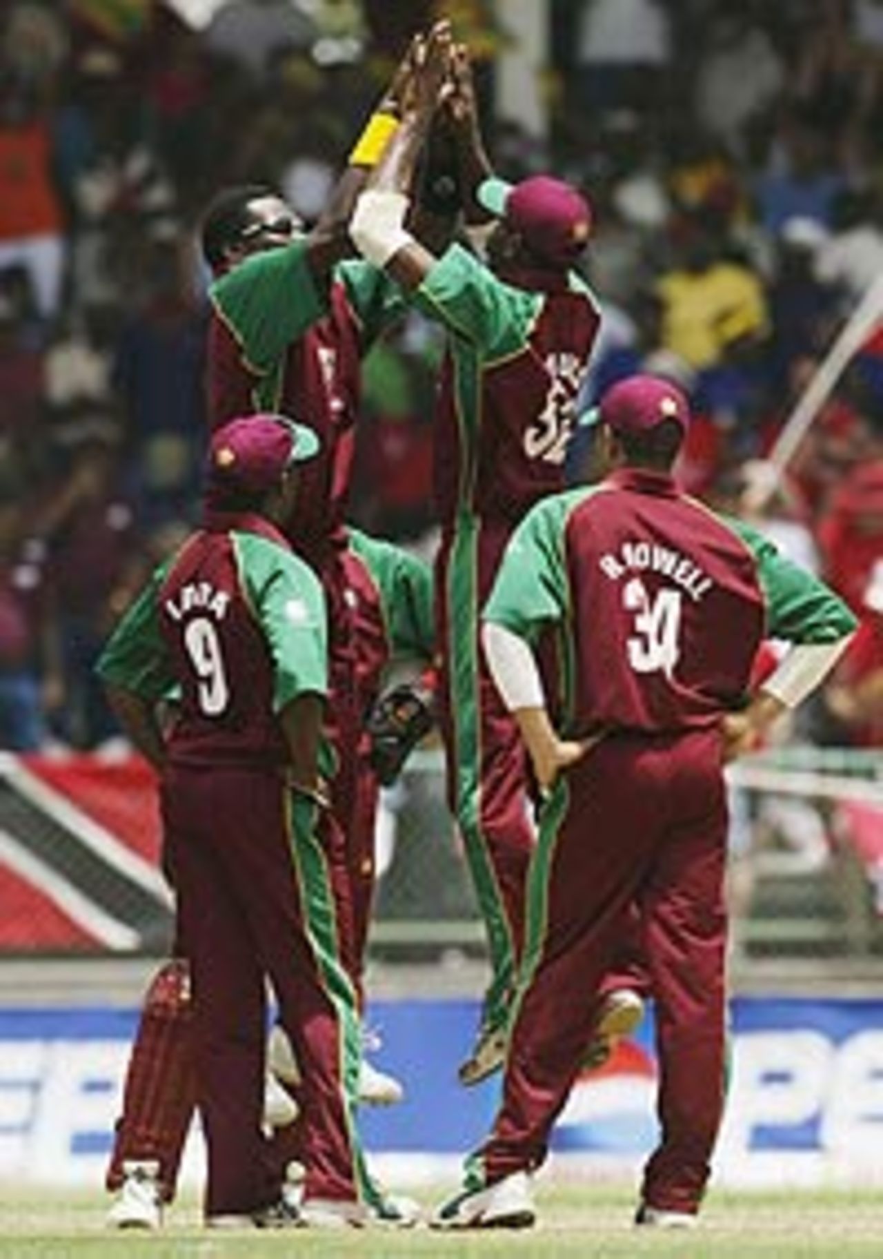 Chris Gayle and Marlon Samuels celebrate a wicket, WI v Aus, May 30 , 2003