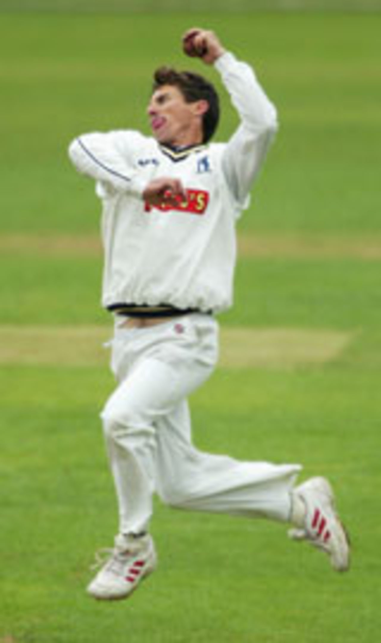 Brad Hogg bowling for Warwickshire v Gloucestershire, Edgbaston, April 30, 2004