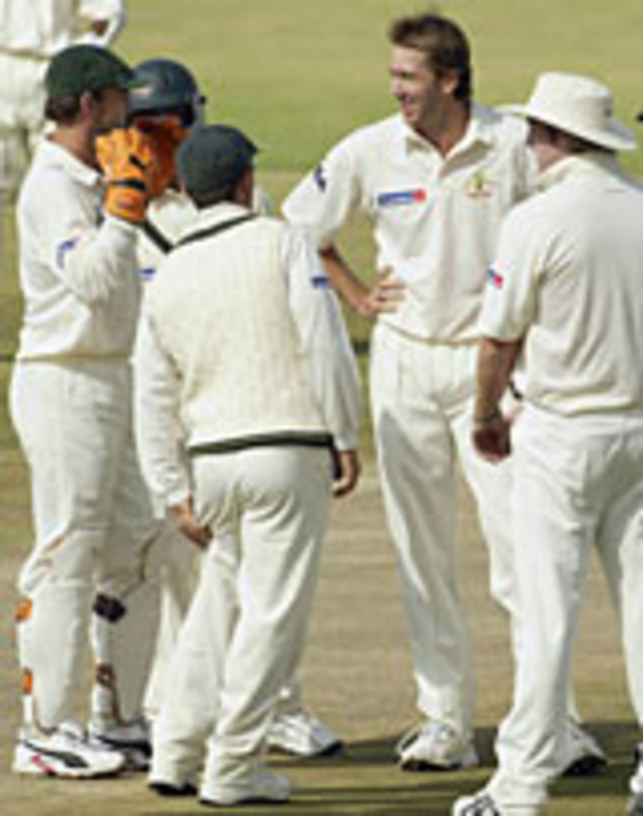 Glenn McGrath celebrates an early wicket on the first day of the Australians tour opener in Harare, May 17, 2004