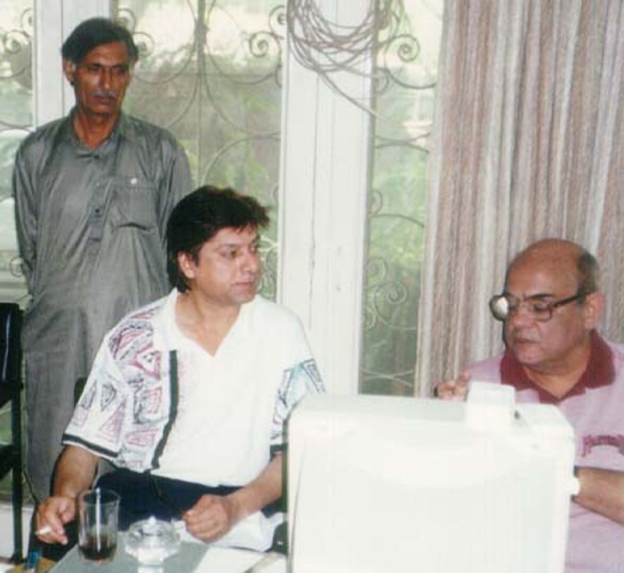 Mohsin Khan at his Interview on 1 June 1998 with Mohammad Din, QDO Admin Officer standing behind him