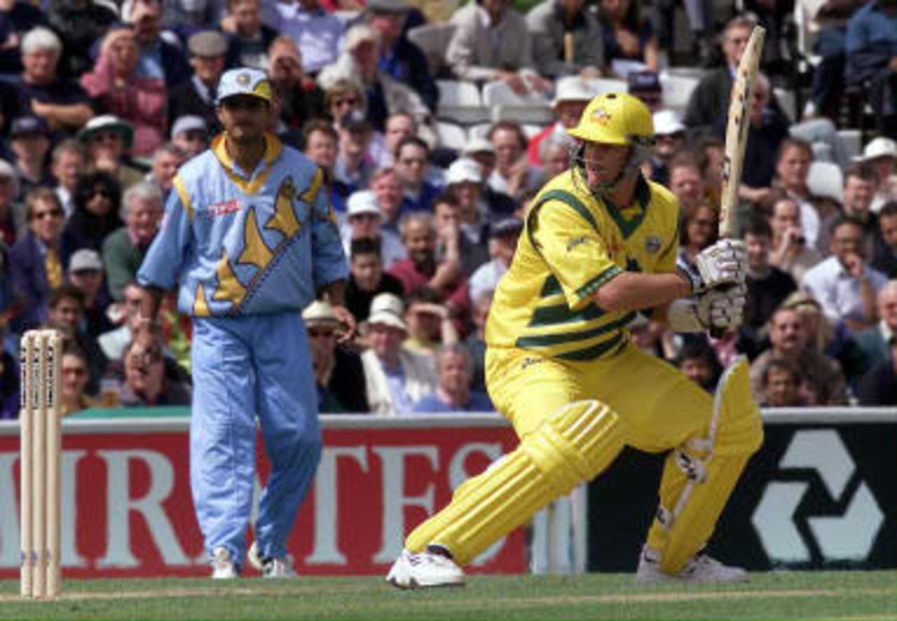 Mark Waugh (R) of Australia opens the batting against India at the Oval in London 04 June 1999 as the play in the cricket World Cup second-round match between Australia and India started