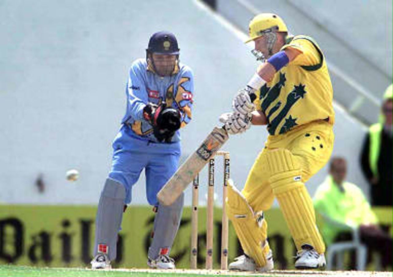 Australian opener Mark Waugh (R) on his way to fifty watched by Nayan Mongia at the Oval in London 04 June 1999 as the play in the cricket World Cup second-round match between Australia and India started