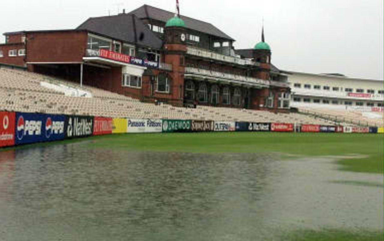 The cricket ground at Old Trafford is flooded 07 June 1999 as ground staff battle to try and ensure that the 08 June 1999 Cricket World Cup game between Pakistan and India will go ahead as planned