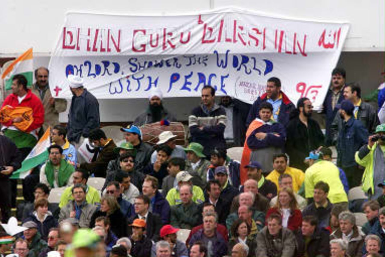 Cricket fans show a sign for peace 08 June 99 during the Cricket World Cup match between India and Pakistan at Old Trafford, in Manchester