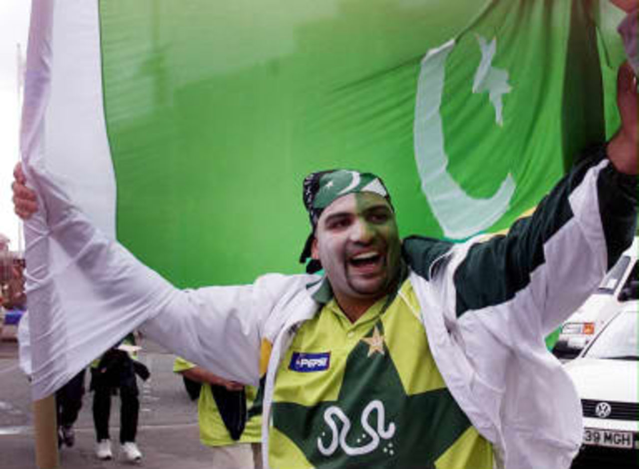 Pakistan fans add colour to the streets of Manchester 08 June 1999 as they arrive for their sides World Cup Cricket clash against India at Old Trafford