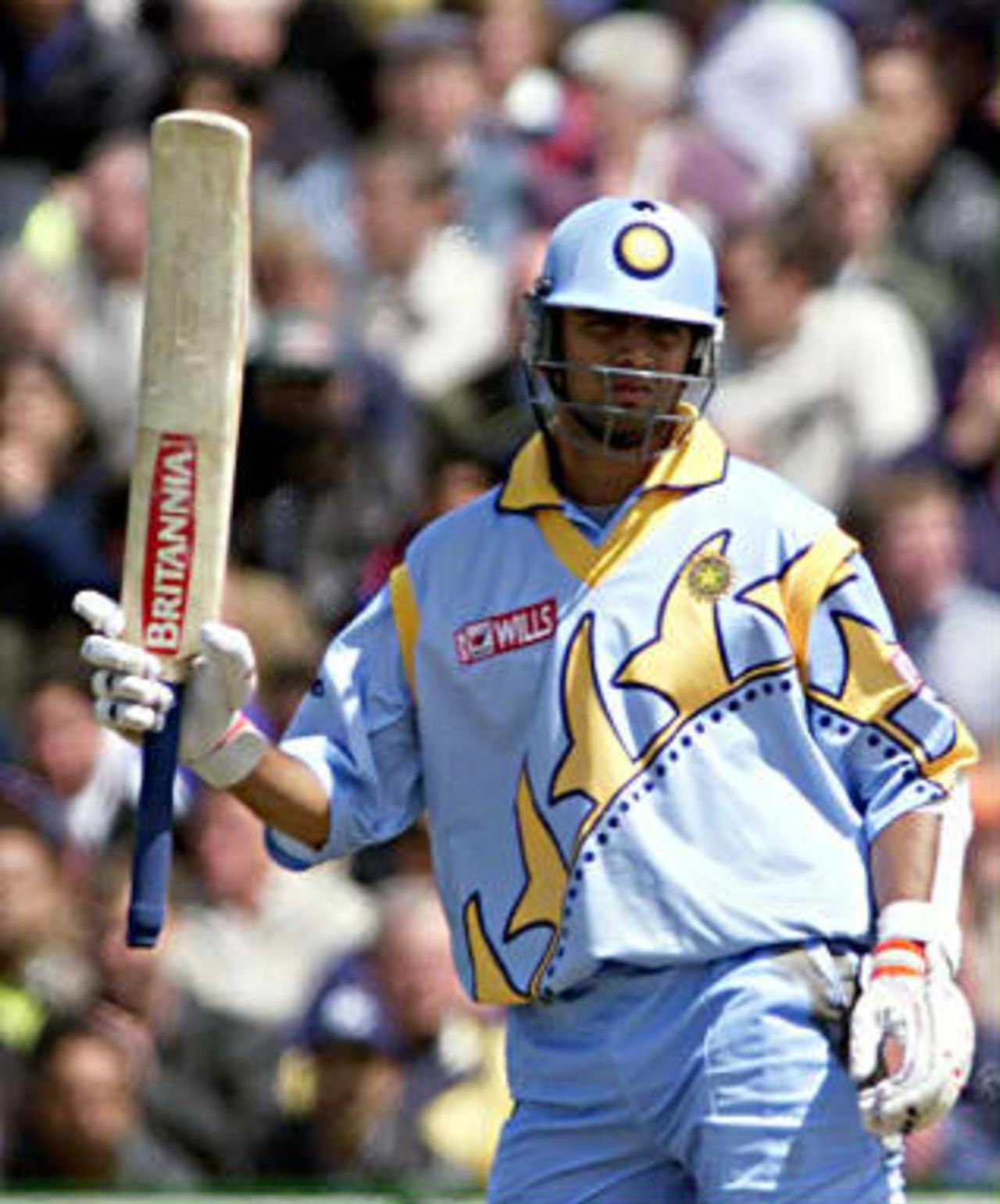 India's Rahul Dravid acknowledges the crowd after scoring 50 runs 08 June 1999 during their Cricket World Cup match at Old Trafford, Manchester