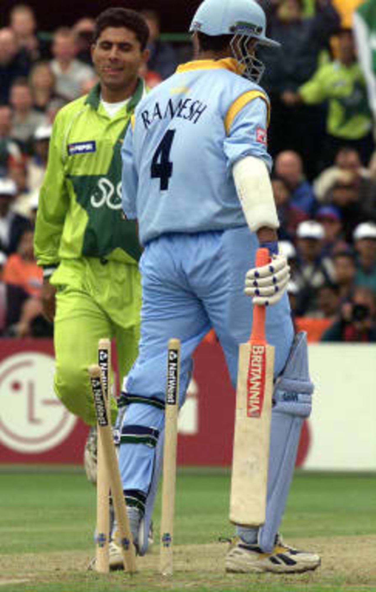 Pakistan`s Abdul Razzaq takes the wicket of Sadagopan Ramesh of India bowled for 20 at Old Trafford 08 June 1999, during the super six match of the Cricket World Cup match in Manchester