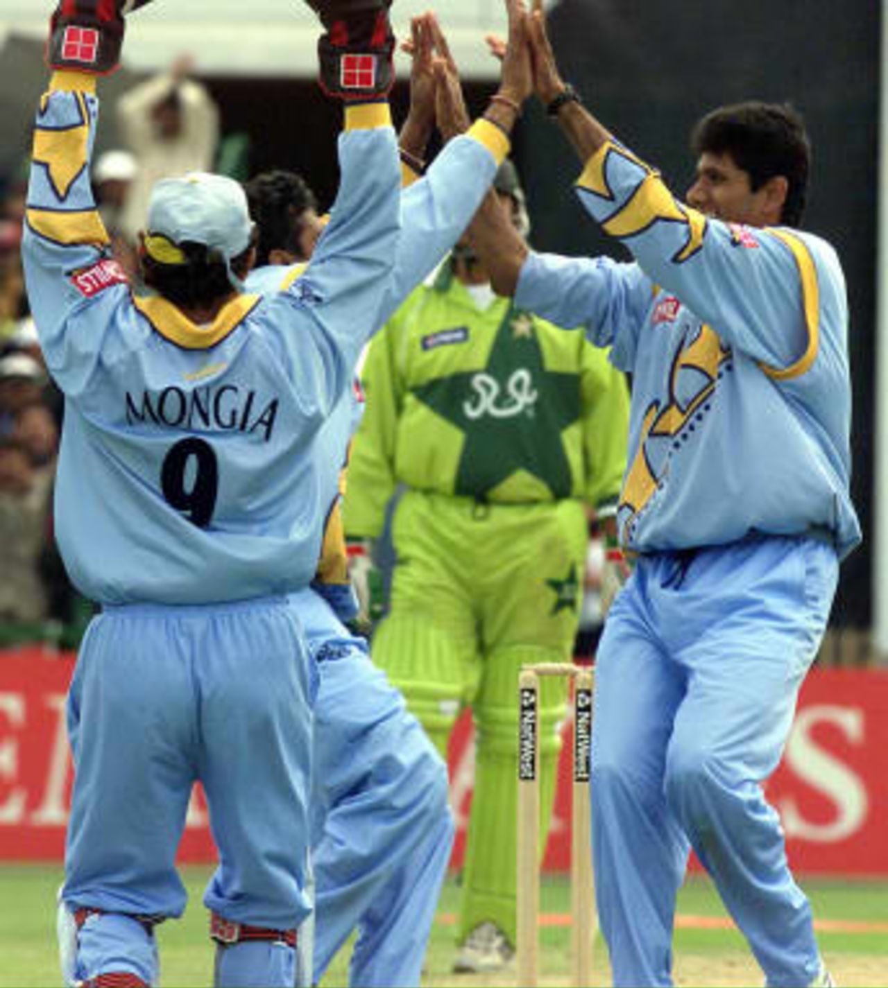 India`s players celebrate taking the wicket of Pakistan`s Saeed Anwar as he was caught by their captain Mohammed Azharuddin during the Cricket World Cup  match at Old Trafford 98 June1999