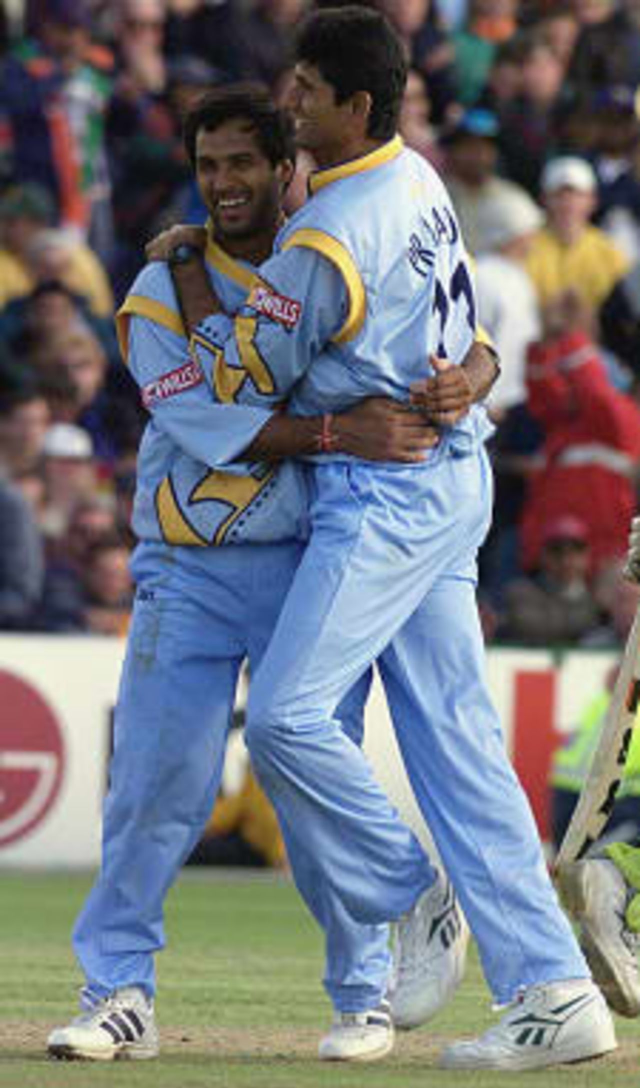 Robin Singh with Man of the Match BK Venkatesh Prasad of India  celebrates one of his five wickets in the match between India and Pakistan in the cricket World Cup series match at Old Trafford which India won by 47 runs. 08 June 1999.