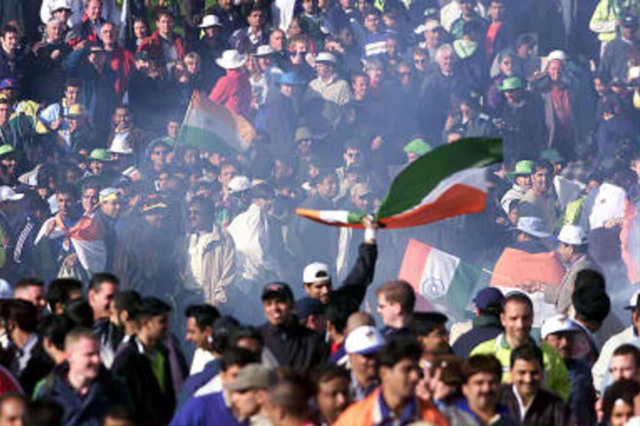 Indian fans celebrate through the haze of firework smoke after their victory over Pakistan at the end of their cricket World Cup match at Old Trafford, Manchester. India won by 47 runs. 08 June 1999.