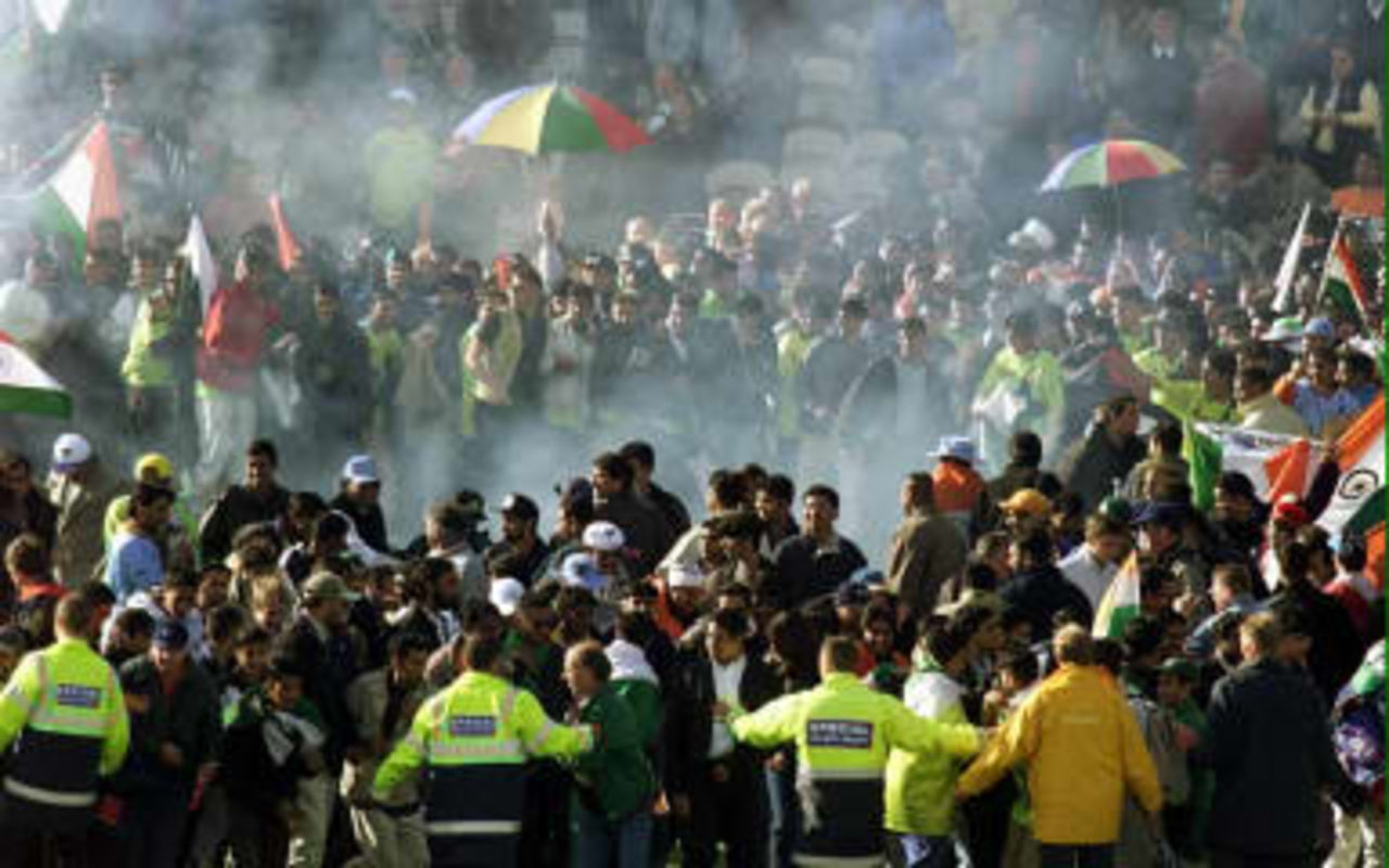 Jubilant Indian fans are scattered by fireworks at Old Trafford, Manchester following their sides victory over Pakistan in the Cricket World Cup. 08 June 1999