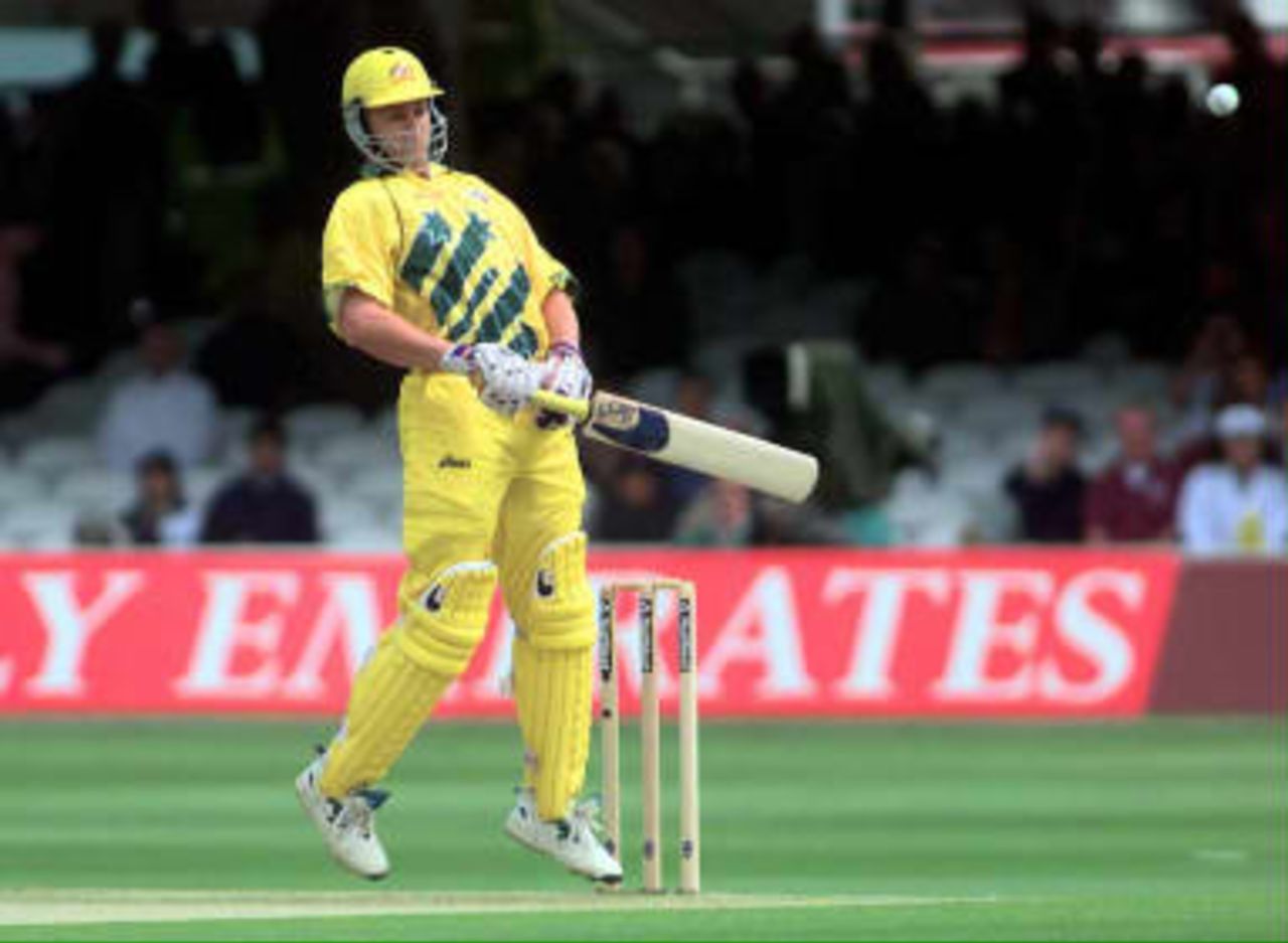 Australian opening batsman Adam Gilchrist, looks uneasy at the crease with this bouncer from Zimbabwe's Neil Johnson, during their Cricket World Cup match at Lords 09 June 1999. Gilchrist was dismissed by Johnson, lbw for 10.