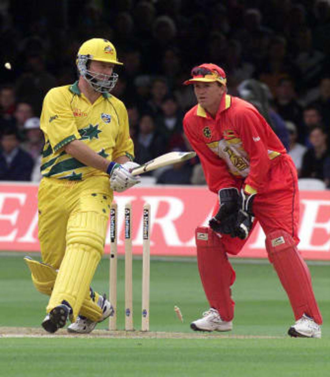 Australia`s captain Steve Waugh (L) bowled by Guy Whittall for 62 during the Australian innings in the match between Zimbabwe vs. Australia in the Cricket World Cup match at Lords 09 June 1999