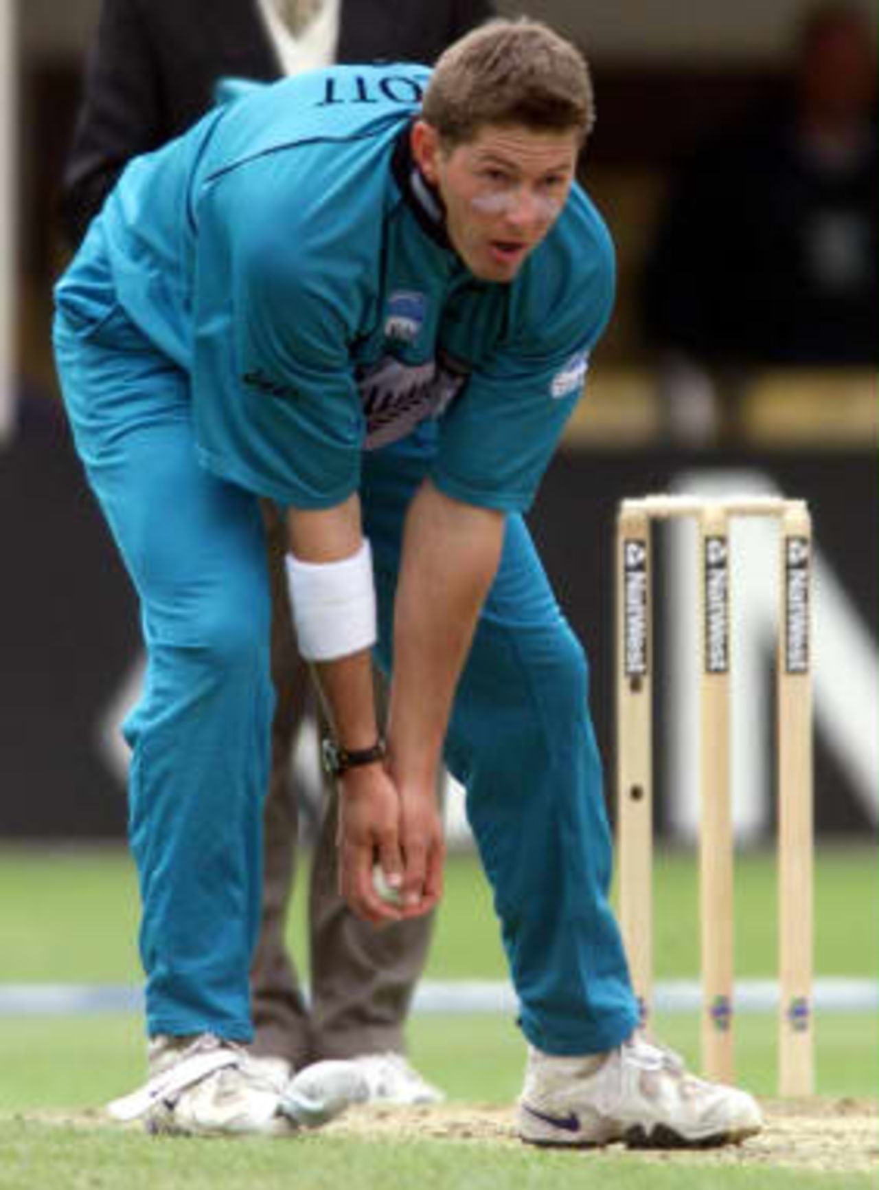 New Zealand bowler Geoff Allott looses his sock from the front of his right boot 10 June 99, during their Super Six match against South Africa in the Cricket World Cup at Edgbaston, Birmingham