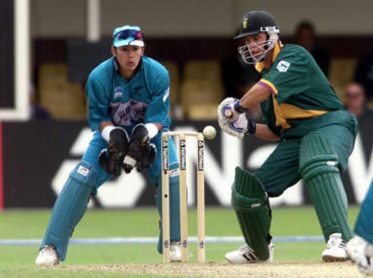South Africa's Herschelle Gibbs hits a four on his way to making 91 runs off the bowling of New Zealand's Chris Harris 10 June 99, during their Super Six match in the Cricket World Cup at Edgbaston, Birmingham. The final will be at Lords on the 20 June 99