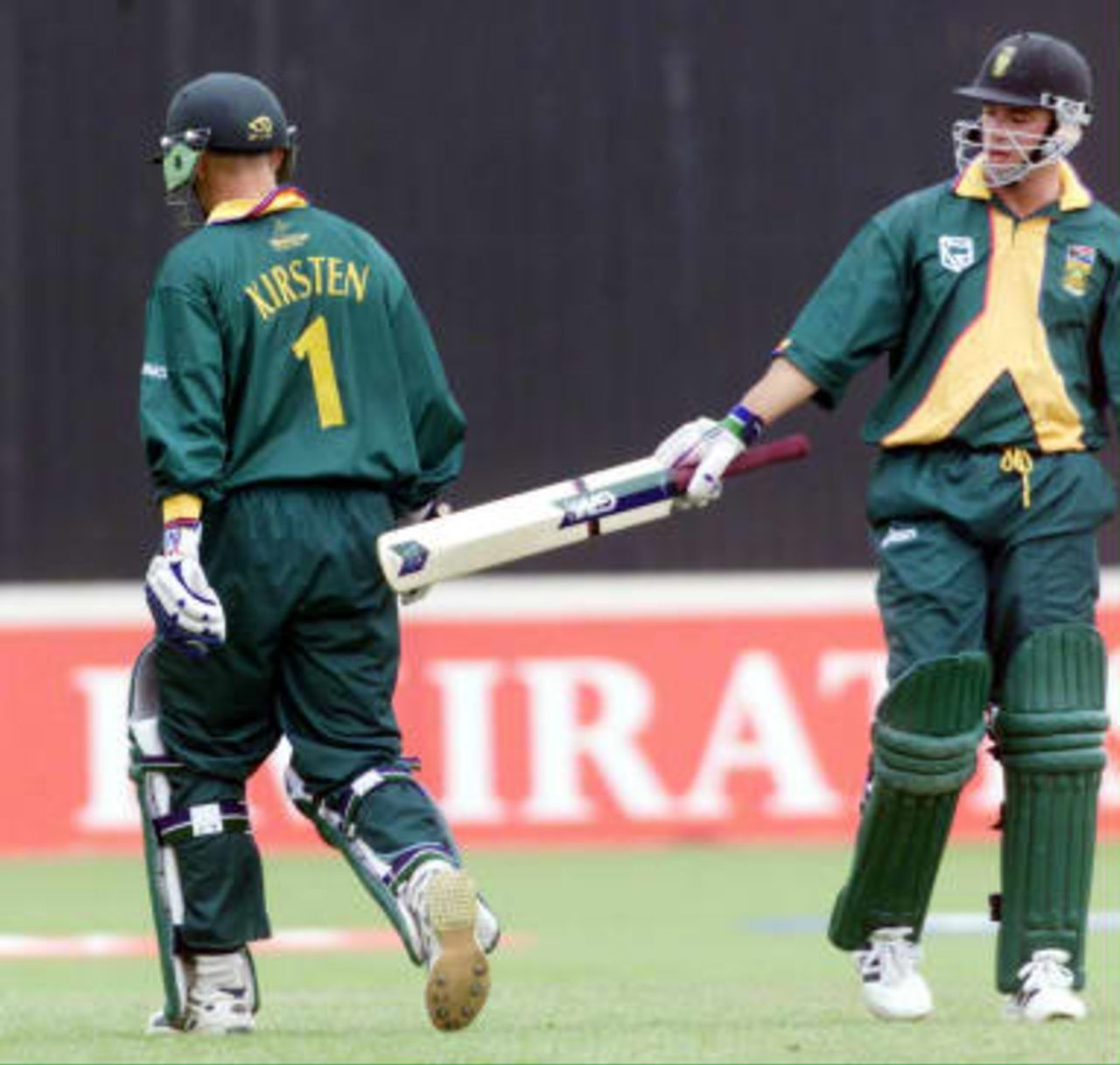 South Africa's Herschelle Gibbs congratulates Gary Kirsten after the couple hit an opening partnership of 176 runs 10 June 99, during their Super Six match against New Zealand in the Cricket World Cup at Edgbaston, Birmingham. The final will be at Lords on the 20 June 99