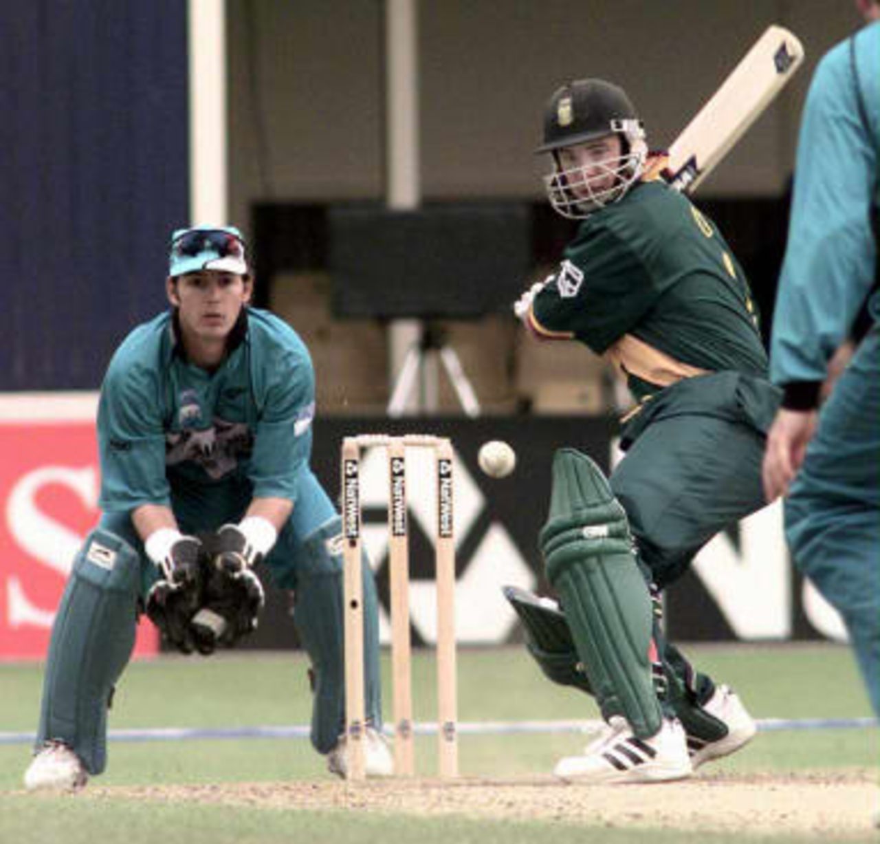South Africa's top scorer Hershelle Gibbs with 91 runs lines up a shot off the bowling of New Zealand's Chris Harris during the Cricket World Cup Super Six match at Edgbaston 10 June 1999