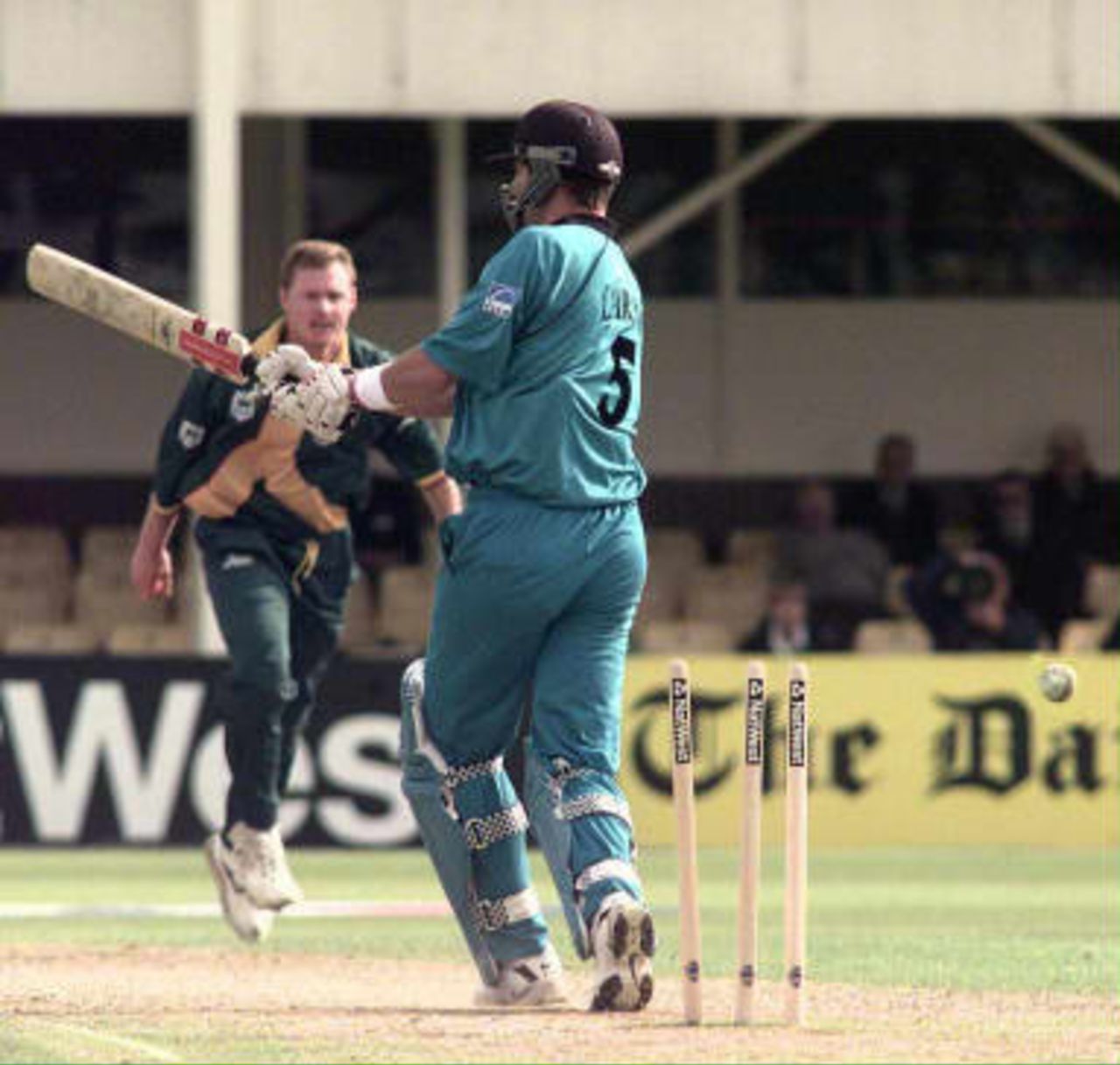 New Zealand Chris Cairns is bowled by Lance Klusener (background) of South Africa during the Cricket World Cup Super Six match at Edgbaston, Birmingham 10 June 1999.