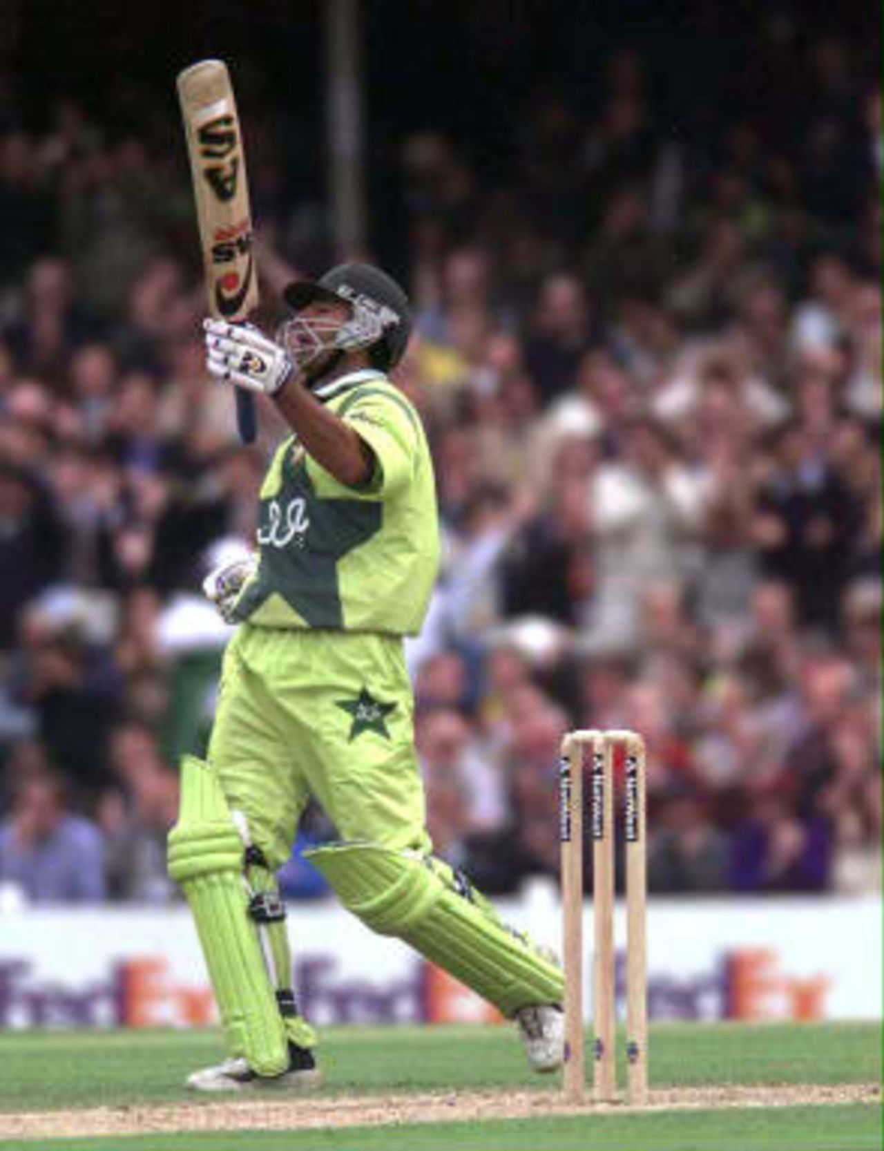 Pakistan opening batsman Saeed Anwar celebrates his century against Zimbabwe, during WC99 Super Six match at The Oval in London