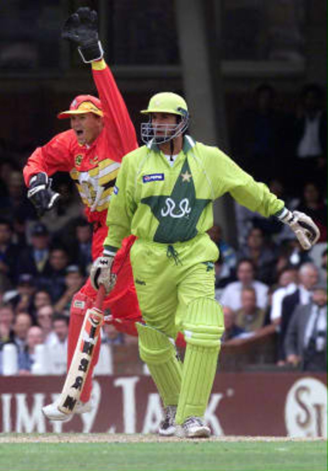 Zimbabwe wicket keeper Andy Flowers celebrates as Wasim Akram, captain of Pakistan, is out lbw off  Adam Huckle bowling, without scoring  any runs against Zimbabwe at the Cricket World Cup match  at the Oval, London, 11 June 1999