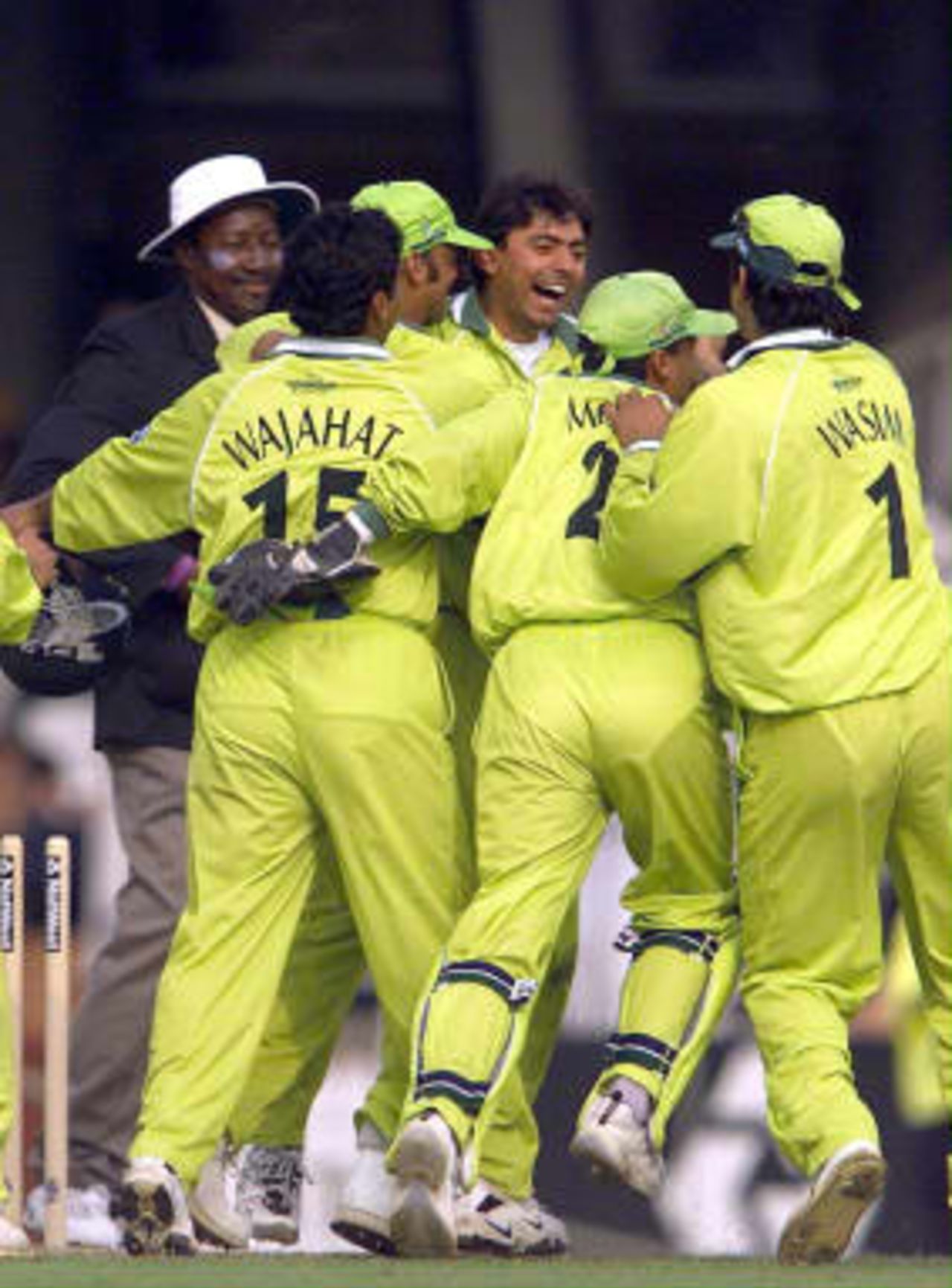 Saqlain Mushtaq (Center facing) of Pakistan celebrates with teammates after taking his hat trick as Pakistan beat Zimbabwe at the Cricket World Cup match  at the Oval, London, 11 June 1999.