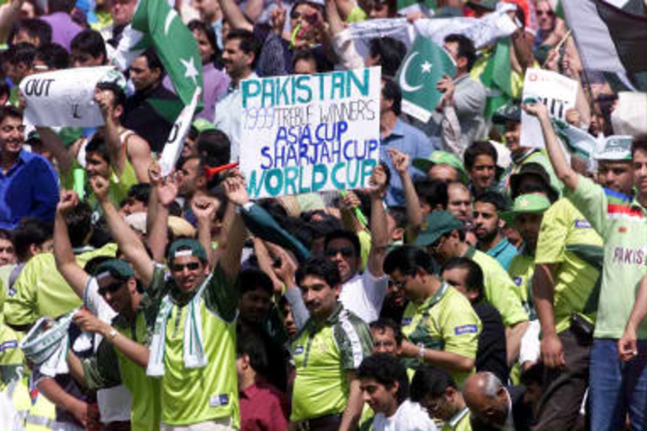 Pakistan fans celebrate, with a reference to the treble, after Pakistan's fast bowler Shoaib Akhtar took the wicket of New Zealand's opening batsman Nathan Astle 16 June 99,  during the semi-final match in the Cricket World Cup at Old Trafford, Manchester. The final will be at Lords on the 20 June 99