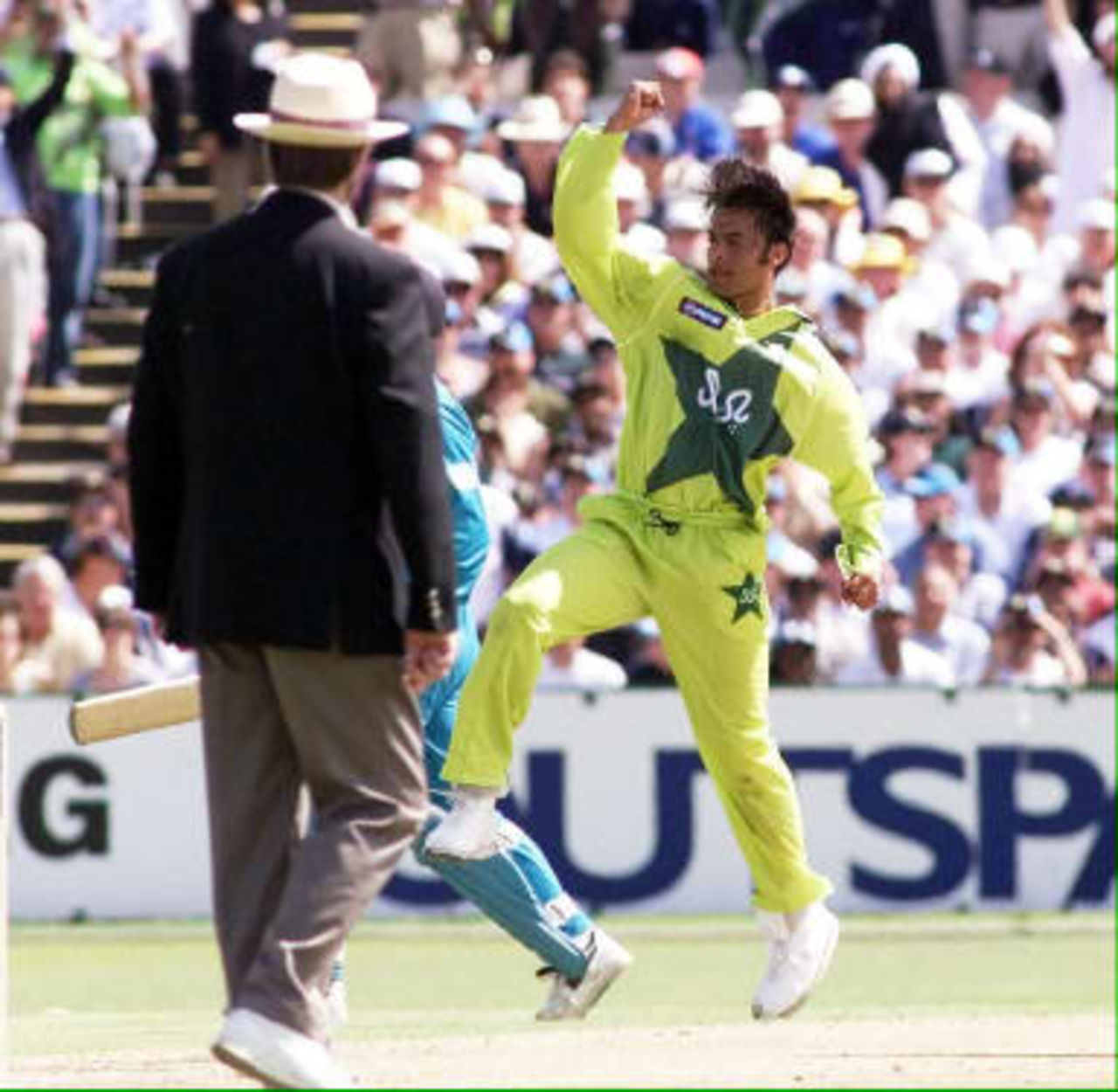 Pakistani fast bowler Shoaib Akhtar celebrates bowling  New Zealand's Nathan Astle in the semi-final of the 1999 Cricket World Cup at Old Trafford in Manchester, 16 June, 1999