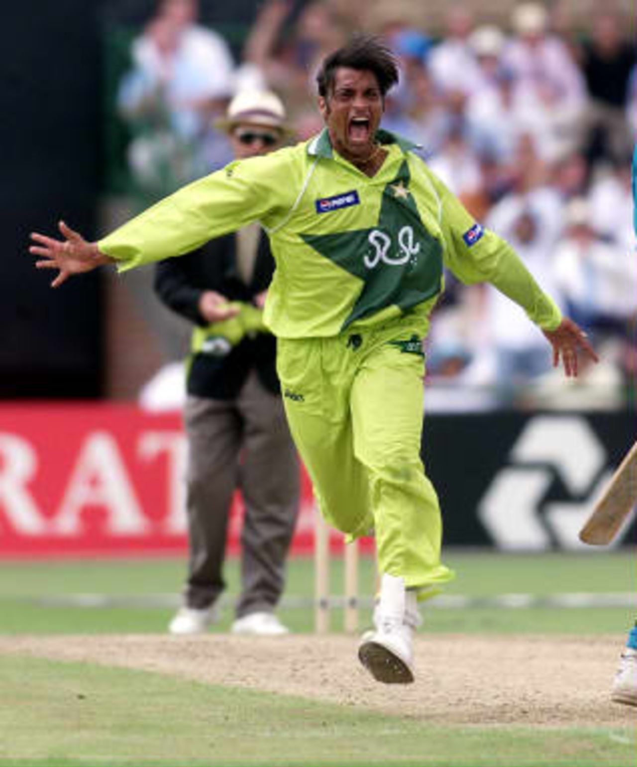 Pakistan's fast bowler Shoaib Akhtar screams with delight after clean bowling New Zealand captain Stephen Fleming 16 June 1999,  during their semi-final match in the Cricket World Cup at Old Trafford, Manchester.  The final will be at Lords 20 June 1999