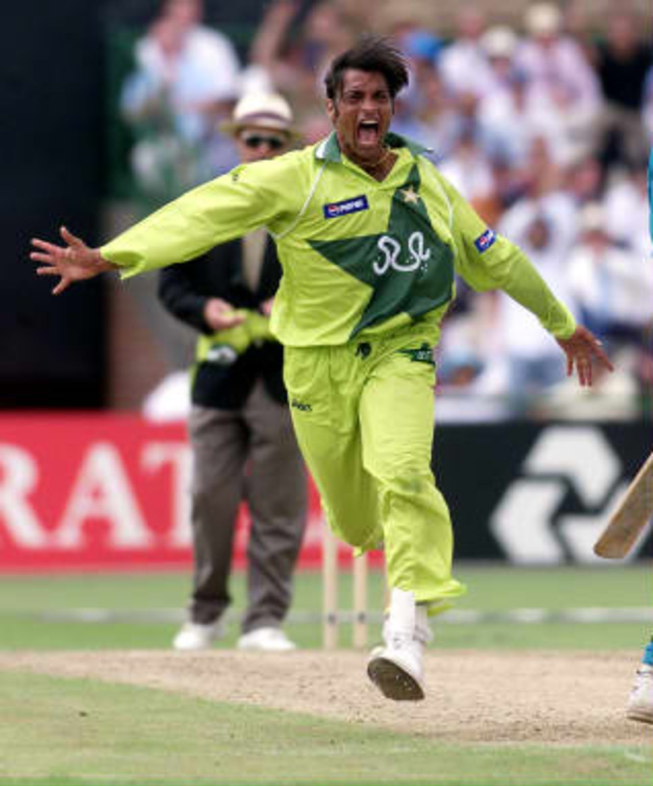Pakistan's fast bowler Shoaib Akhtar screams with delight after clean bowling New Zealand captain Stephen Fleming 16 June 1999, during their semi-final match in the Cricket World Cup at Old Trafford, Manchester. The final will be at Lords 20 June 1999