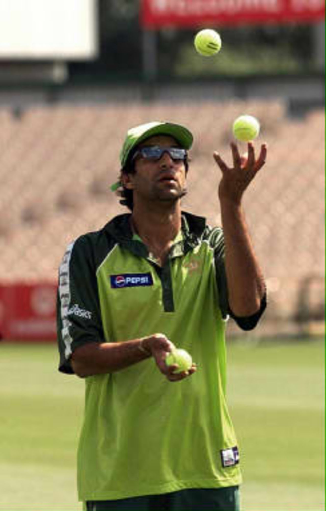 Pakistan captain Wasim Akram juggles with tennis balls during a nets practice session at Old Trafford, Manchester, 15 June 1999 prior to his sides Cricket World Cup semi-final match against New Zealand 16 June 1999