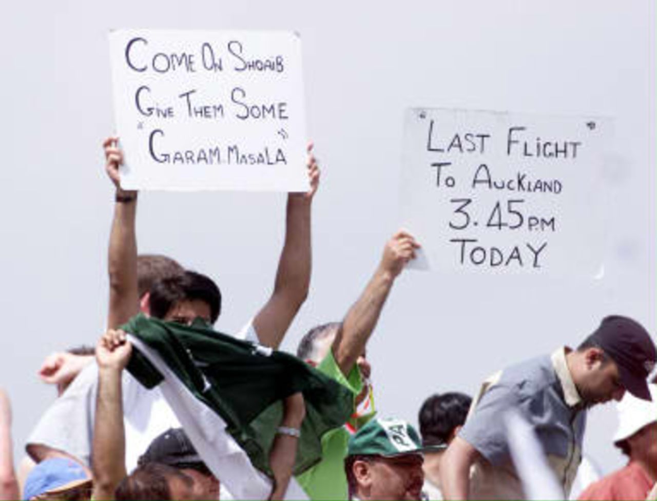 Pakistani fans offer messages to the teams during their semi-final match against New Zealand in the Cricket World Cup at Old Trafford, Manchester, 16 June 1999.