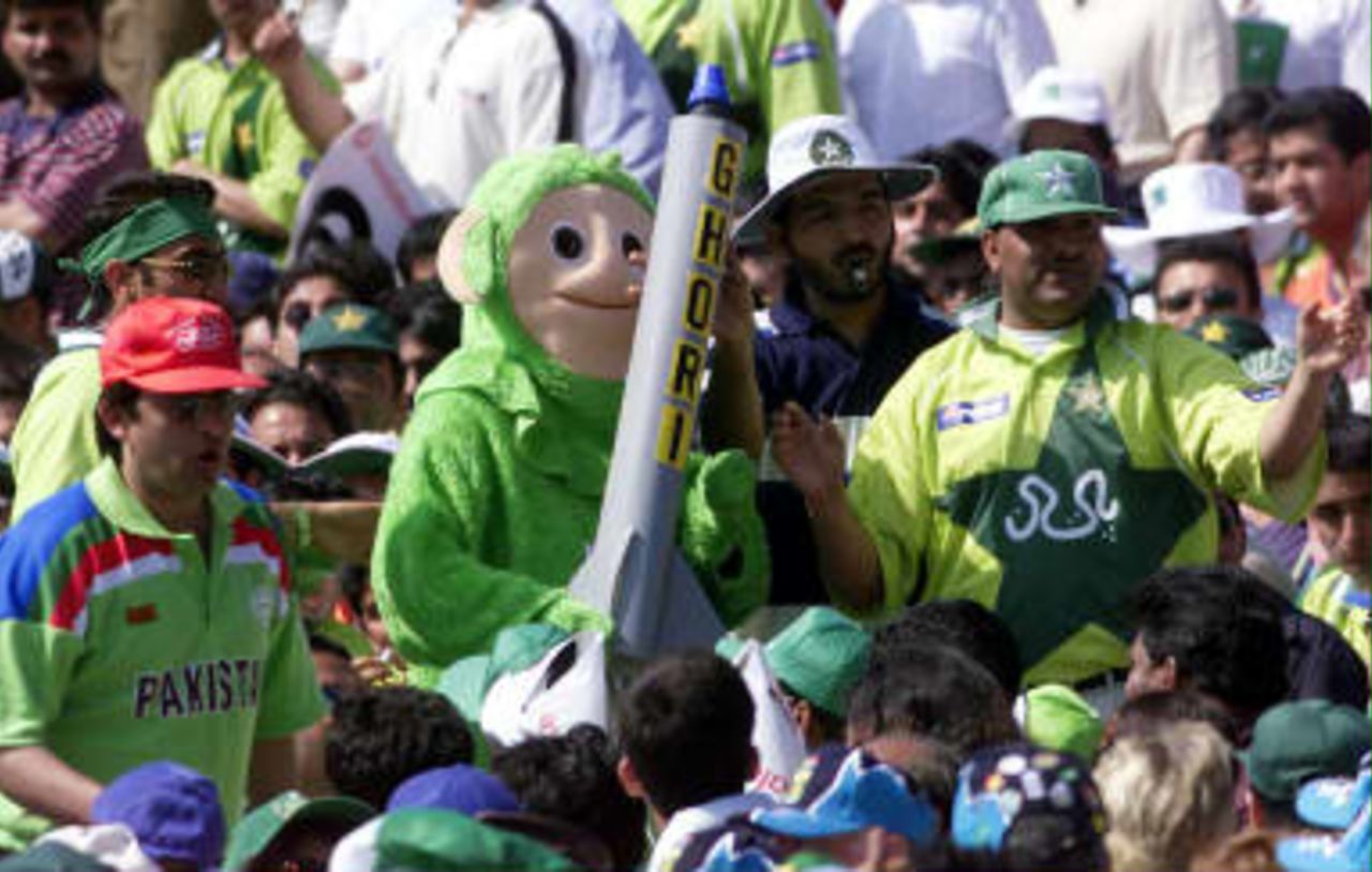 Pakistani fans carry a toy missile through the crowd during their semi-final match against New Zealand in the Cricket World Cup at Old Trafford, Manchester, 16 June 1999.