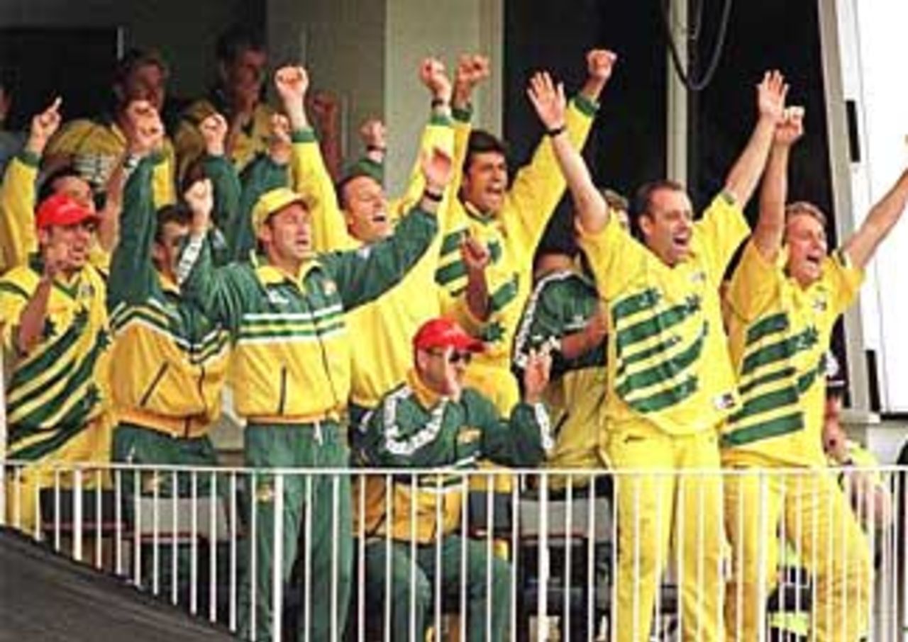 The Australian team cheer as captain Steve Wuagh hits the winning run against South Africa in their Super Six match at Leeds. June 13, 1999.