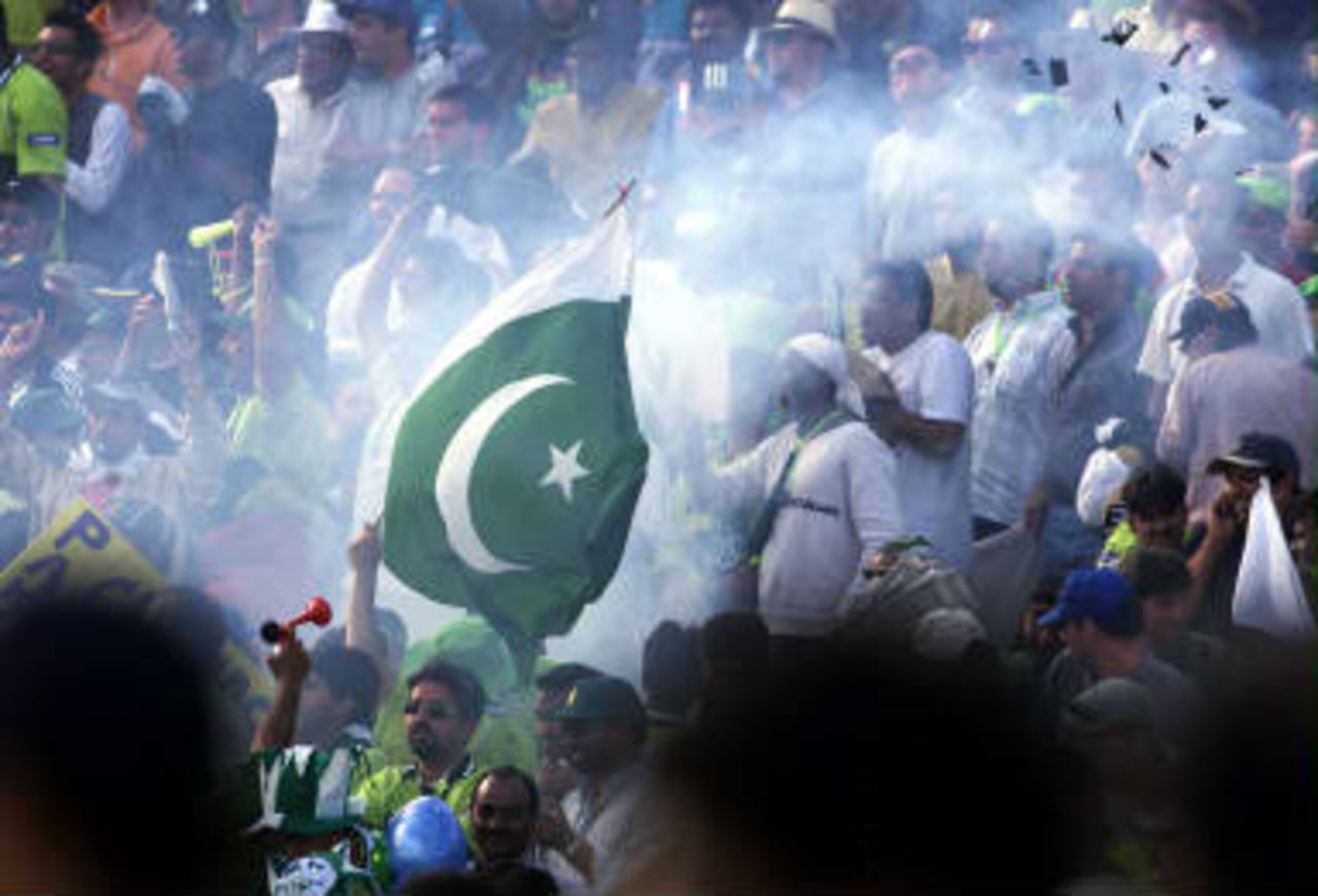 Pakistani fans celebrate after their side's victory over New Zealand 16 June 1999 in the semi-final in the Cricket World Cup at Old Trafford, Manchester. The final will be at Lords