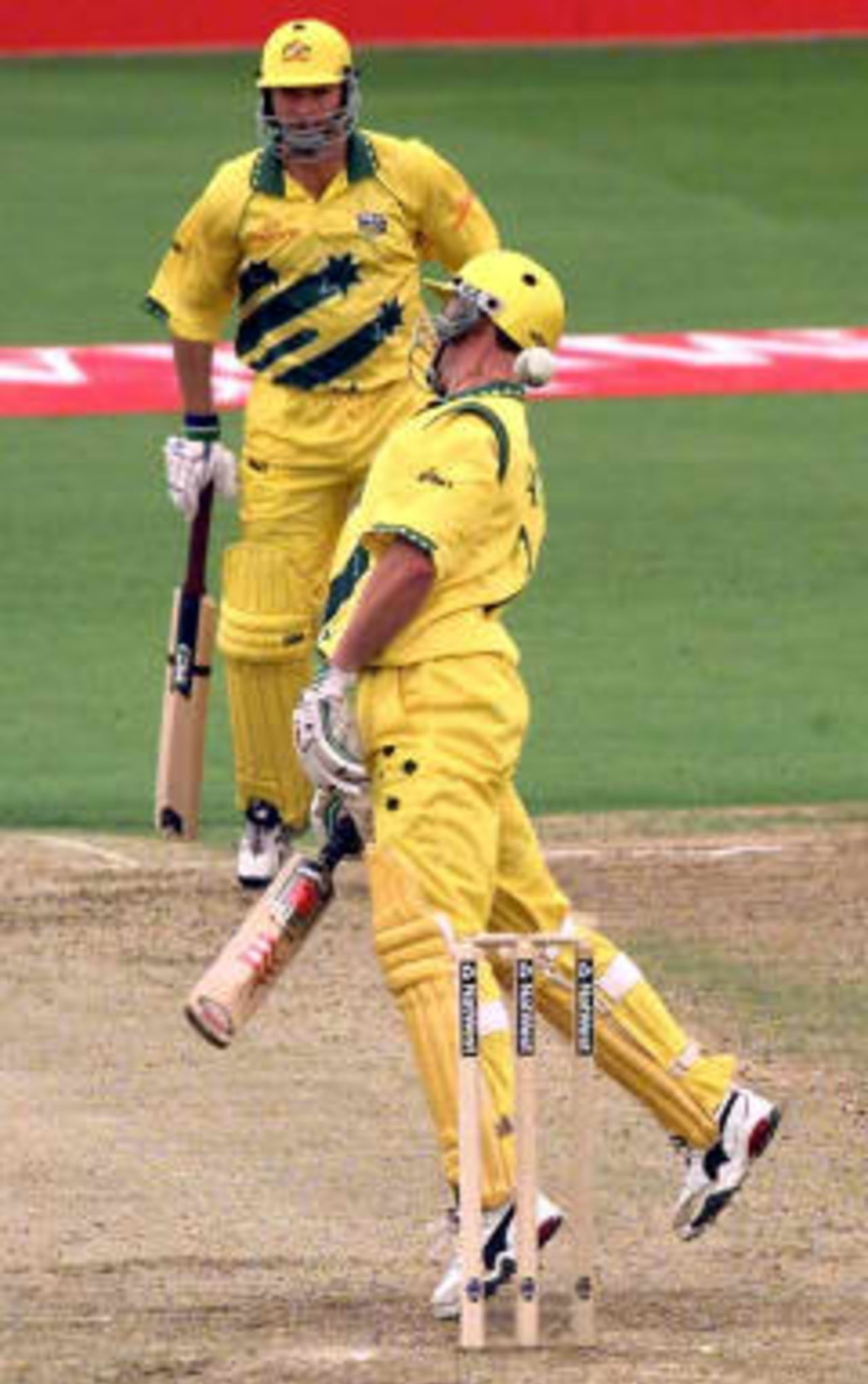 Rough treatment for Michael Bevan (front) of Australia as Captain Steve Waugh looks on as a high ball from Donald just misses Bevan in their Cricket World Cup semi-final 17 June 1999