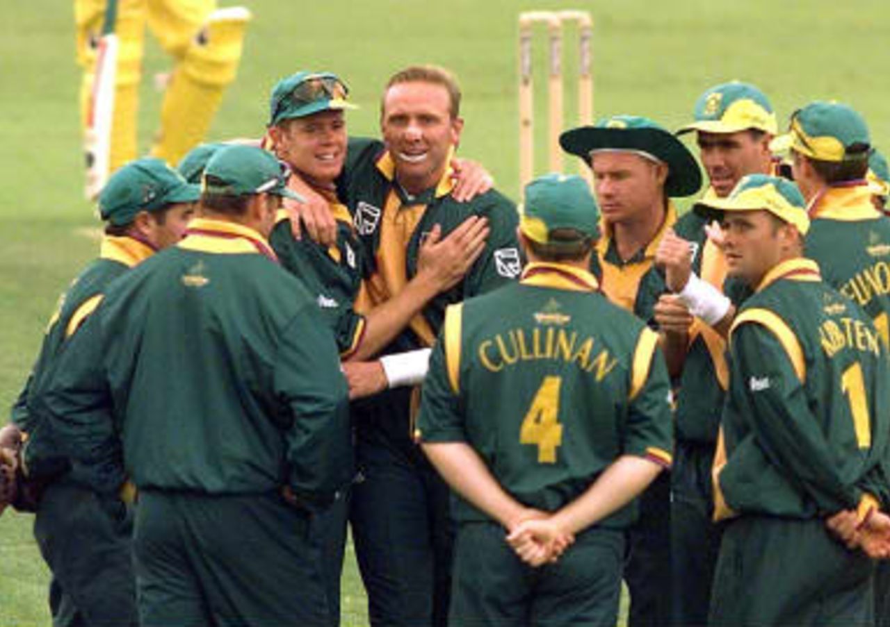 South African bowlers Shaun Pollock and Allan Donald congratulate each other after ripping through the Australian batting in their Cricket World Cup semi-final at the Edgbaston ground in Birmingham 17 June 1999
