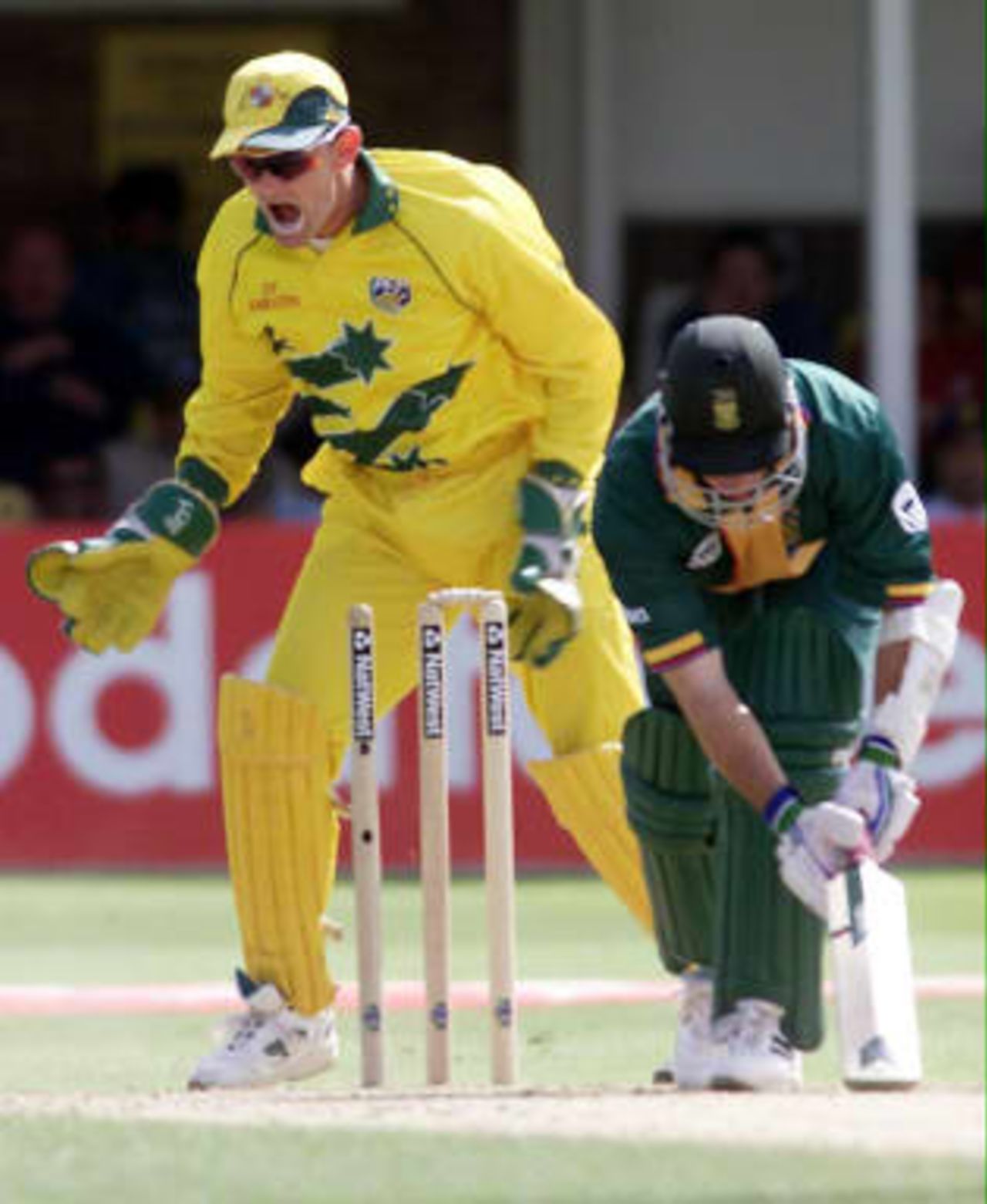 South Africa's Herschelle Gibbs is out bowled by Australia's Shane Warne to the delight of wicket keeper Adam Gilchrist 17 June 1999,  during their semi-final match in the Cricket World Cup at Edgbaston, Birmingham. The final will be at Lords  20 June 1999