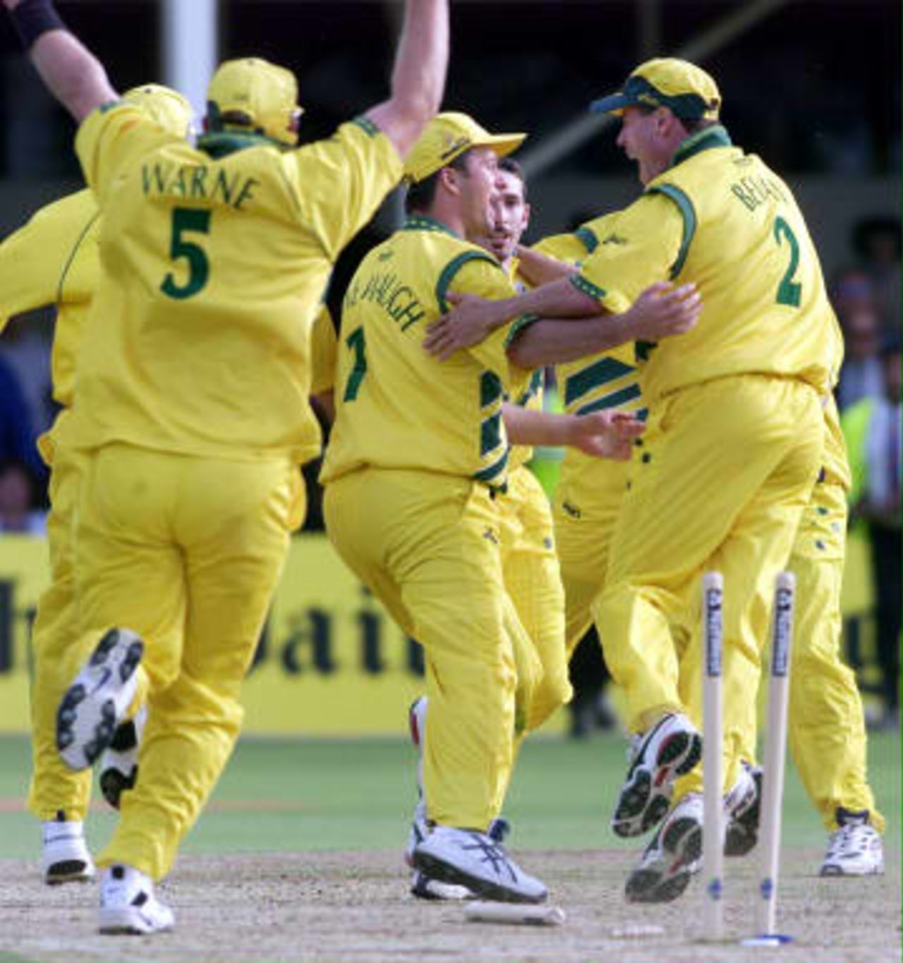 Australia's Shane Warne (Left), Steve Waugh (Right) and Michael Bevan celebrate after they run out Allan Donald for victory over South Africa during their semi-final match in the Cricket World Cup at Edgbaston, Birmingham, 17 June 1999.