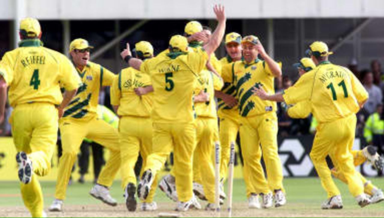 The Australian cricket team celebrate their dramatic victory over South Africa as the stumps are broken after Allan Donald was run out in the Cricket World Cup Semi Final at Edgbaston, Birmingham, 17 June 1999.