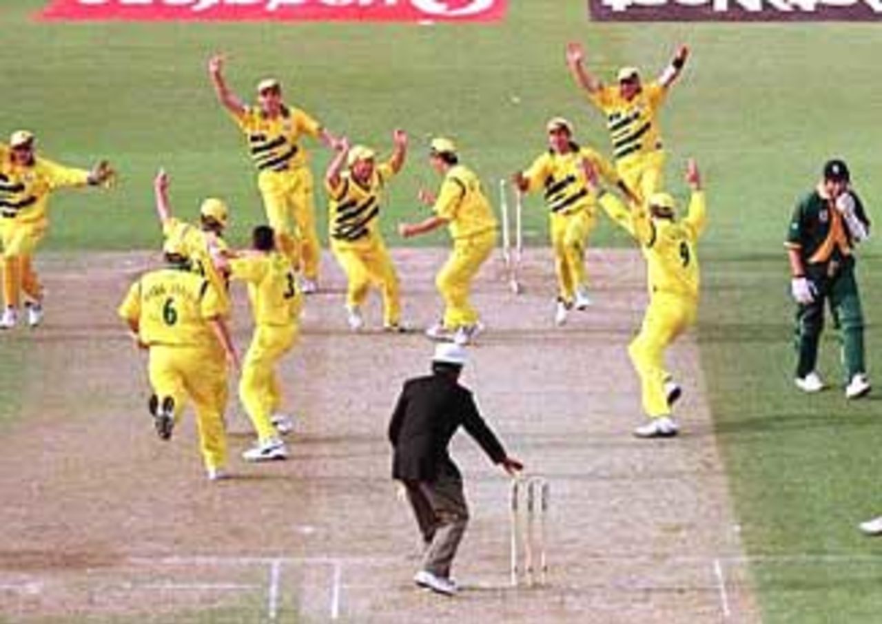 The Australians celebrate the run out of Alan Donald to tie the match against South Africa. This semi-final was the first tied match ever in the World Cup. June 17, 1999.