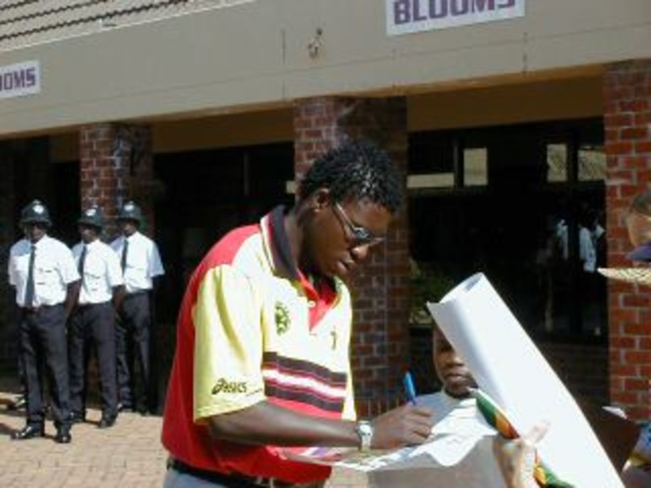 "Pom" Mbangwa signs autographs - The Zimbabwe World Cup team is welcomed home  with a parade in Harare - 19 June 1999