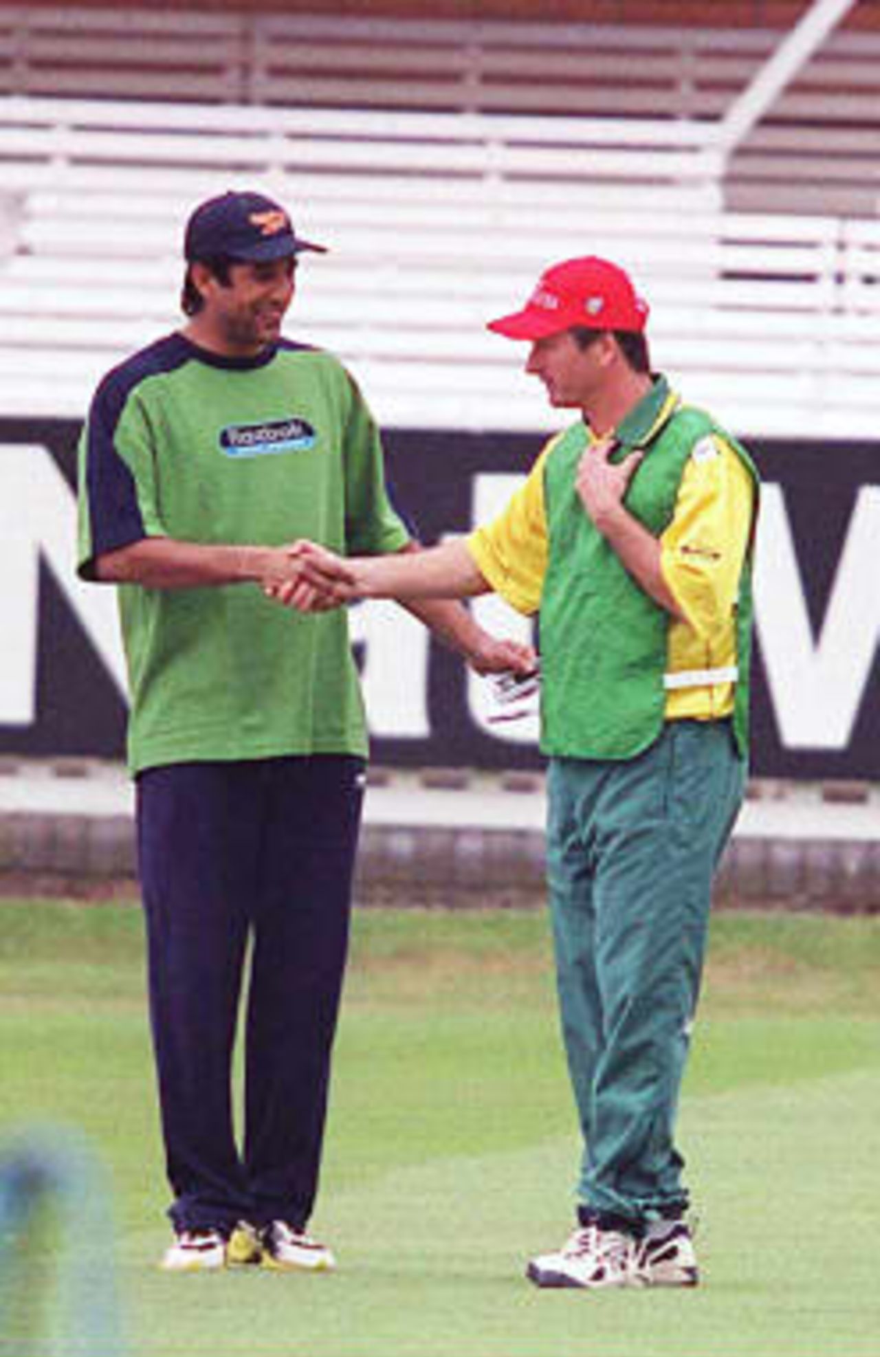 Pakistan's Wasim Akram (Left) and Steve Waugh of Australia, the two captains for tommorow's Cricket World Cup final shake hands on the Lords pitch in London on 19 June 1999.