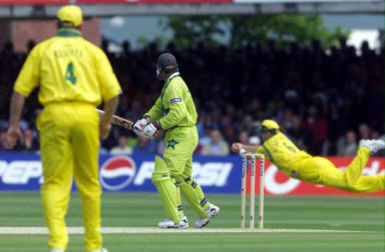 Pakistan's opening batsman Wajahatullah Wasti is out due to a fine diving catch at second slip by Australia's Mark Waugh in the Cricket World Cup final at Lords in London 20 June 1999